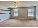 Large bedroom with wood accent wall and two windows at 137 Nobility Ln, Mcdonough, GA 30252
