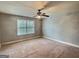 Spacious bedroom with carpet, neutral walls, and a window letting in natural light at 137 Nobility Ln, Mcdonough, GA 30252