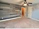 Bedroom with hardwood-look accent wall and a ceiling fan/light fixture overhead at 137 Nobility Ln, Mcdonough, GA 30252
