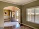Open entryway leading into various rooms, with hardwood floors and a decorative front door at 137 Nobility Ln, Mcdonough, GA 30252