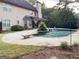 Backyard showcasing an inground pool with a diving board and well maintained patio area at 137 Nobility Ln, Mcdonough, GA 30252