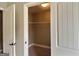 View of a walk-in closet with shelving and door at 137 Nobility Ln, Mcdonough, GA 30252