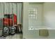 Relaxing bathroom featuring soaking tub and a unique shower curtain, offering a comfortable space at 1170 Peeksville Rd, Locust Grove, GA 30248