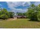 Charming single-story home featuring an attached two-car garage and a well-maintained lawn at 1170 Peeksville Rd, Locust Grove, GA 30248