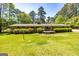 Large backyard with a deck, perfect for outdoor entertaining and relaxation in a private setting at 160 Pine Trail Rd, Fayetteville, GA 30214