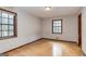 Bright bedroom featuring hardwood floors and abundant natural light through two well-placed windows at 160 Pine Trail Rd, Fayetteville, GA 30214