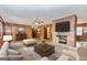 Living room with brick fireplace, hardwood floors and comfortable seating at 160 Pine Trail Rd, Fayetteville, GA 30214