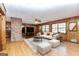 Bright living room features wood walls, large windows, and hardwood floors at 160 Pine Trail Rd, Fayetteville, GA 30214