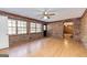 Living room with brick walls, hardwood floors and natural light at 160 Pine Trail Rd, Fayetteville, GA 30214
