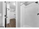 Bathroom featuring a shower stall with a black shower head, and a door to the walk-in closet at 355 Sturgess Run, Sharpsburg, GA 30277