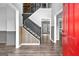 Inviting foyer with a staircase, wood-look flooring, and a view into multiple rooms of the home at 355 Sturgess Run, Sharpsburg, GA 30277