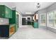 Bright and spacious kitchen with an island, modern appliances, and plenty of cabinet space. Some cabinets unfinished at 355 Sturgess Run, Sharpsburg, GA 30277