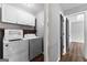 Laundry room with white washer, dryer, and cabinets at 355 Sturgess Run, Sharpsburg, GA 30277