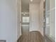 View of the entryway with wood-look floors leading into the living space at 13 Butternut Way # 120B, Auburn, GA 30011