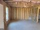 Unfinished basement with framed walls, a window, a door, and exposed ceiling at 42 Avian Way # 128B, Auburn, GA 30011
