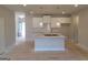 Bright, modern kitchen with granite countertops, white cabinets, pendant lighting, and tile backsplash at 42 Avian Way # 128B, Auburn, GA 30011
