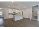 Kitchen with island, stainless appliances, and hardwood flooring at 42 Avian Way # 128B, Auburn, GA 30011