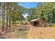 Picturesque horse barn featuring rustic wood, fenced pastures and ample space at 99 Landers Ne Rd, Rydal, GA 30171