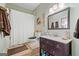 Well-lit bathroom with a shower, toilet, and a vanity with dark wood cabinets at 99 Landers Ne Rd, Rydal, GA 30171