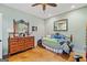 Cozy bedroom featuring a vintage-style bed frame and dresser at 99 Landers Ne Rd, Rydal, GA 30171