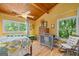 This bedroom features natural light, wood floors, and vaulted wood ceilings at 99 Landers Ne Rd, Rydal, GA 30171
