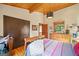 Cozy bedroom features a wooden ceiling, an oversized wardrobe, and lots of natural light at 99 Landers Ne Rd, Rydal, GA 30171