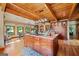 Bright dining room with natural light, a large dining table, and custom cabinets at 99 Landers Ne Rd, Rydal, GA 30171