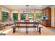 Bright dining room with lots of natural light, a large wood table, and custom built-ins at 99 Landers Ne Rd, Rydal, GA 30171