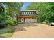 Three-car garage with ample parking space on a private lot at 99 Landers Ne Rd, Rydal, GA 30171