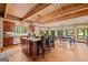 Gourmet kitchen features an oversized island, seating, granite countertops and modern lighting at 99 Landers Ne Rd, Rydal, GA 30171