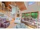 Spacious living room with wood flooring, high ceilings, and a staircase to upper level at 99 Landers Ne Rd, Rydal, GA 30171