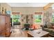 Inviting living room with a cozy wood-burning stove and natural light from surrounding windows at 99 Landers Ne Rd, Rydal, GA 30171