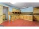 Basement workshop with built-in storage, cabinets, and workbench area at 520 Lakecourt Dr, Mcdonough, GA 30253