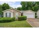 Charming single-story home featuring stone accents, manicured landscaping, and an attached two-car garage at 520 Lakecourt Dr, Mcdonough, GA 30253