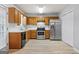 Updated kitchen with stainless steel appliances, wood cabinets, and new floors at 520 Lakecourt Dr, Mcdonough, GA 30253