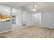 This open-concept living room flows into the kitchen, creating a seamless and inviting space at 520 Lakecourt Dr, Mcdonough, GA 30253