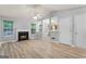 Bright living room featuring a fireplace, new floors, and an open layout at 520 Lakecourt Dr, Mcdonough, GA 30253