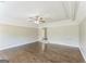 Bright living room featuring hardwood floors, recessed lighting, and detailed ceiling molding at 195 Southmoor Cir, Stockbridge, GA 30281