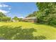 Well-maintained exterior featuring lush green grass and mature landscaping for an inviting curb appeal at 195 Southmoor Cir, Stockbridge, GA 30281