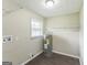 Laundry Room showcasing a window for natural light and convenient storage solutions at 195 Southmoor Cir, Stockbridge, GA 30281