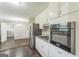 This eat-in kitchen features white cabinets, granite countertops and stainless steel appliances at 195 Southmoor Cir, Stockbridge, GA 30281