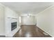 Spacious living room features a painted brick fireplace, hardwood floors and neutral paint at 195 Southmoor Cir, Stockbridge, GA 30281