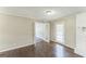 Bright living room featuring hardwood floors, a white brick fireplace, and natural light at 195 Southmoor Cir, Stockbridge, GA 30281