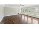 Expansive main bedroom features hardwood floors, neutral paint, many windows and built-in seating at 195 Southmoor Cir, Stockbridge, GA 30281