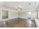Bright living room showcasing hardwood floors, recessed lighting, and detailed ceiling molding at 195 Southmoor Cir, Stockbridge, GA 30281