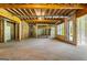The unfinished basement with exposed beams is ready to be transformed into your dream space at 100 Regina Ct, Fayetteville, GA 30215