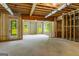 Unfinished basement featuring open framing and natural light, perfect for customization and future expansion at 100 Regina Ct, Fayetteville, GA 30215