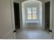 Bright bathroom features a standalone tub under a window and an adjacent shower at 100 Regina Ct, Fayetteville, GA 30215