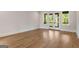 Bright bedroom with hardwood floors and patio doors leading to outdoor space at 100 Regina Ct, Fayetteville, GA 30215