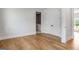 Spacious bedroom with hardwood floors and walk through to the en suite bathroom at 100 Regina Ct, Fayetteville, GA 30215